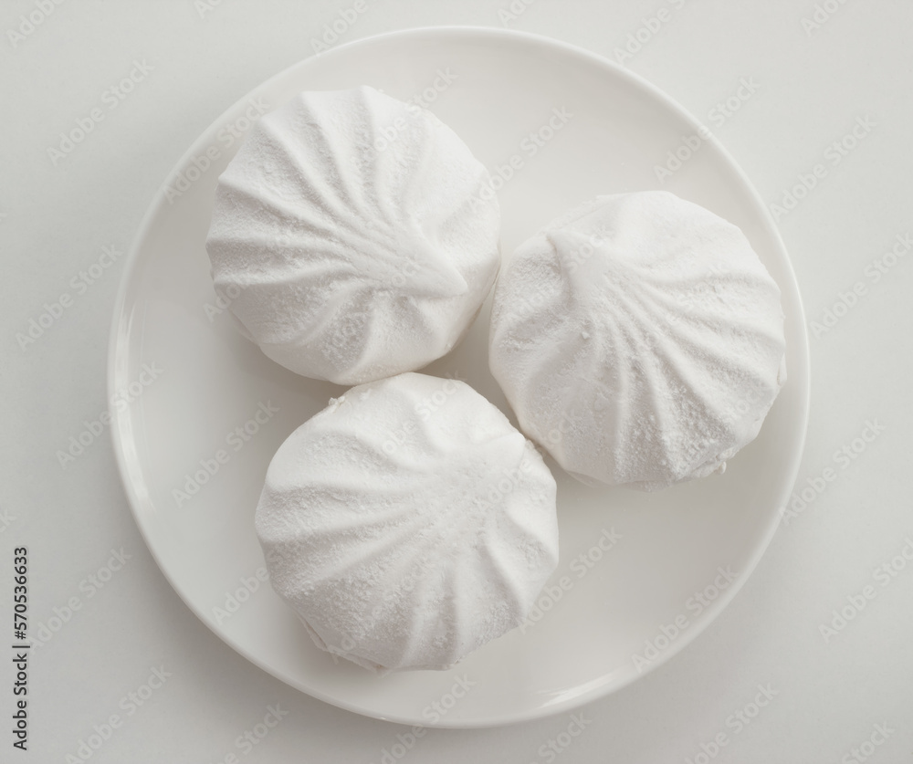 Zephyr or marshmallow soft and airy dessert on white plate