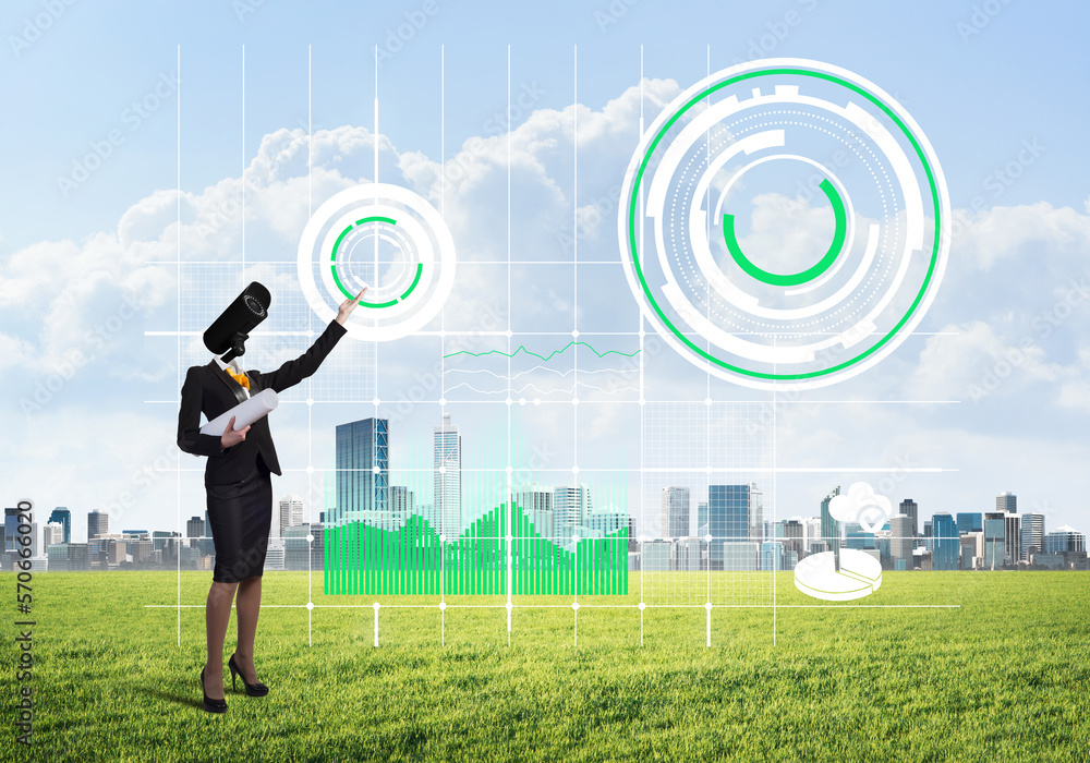 Camera headed woman standing on green grass against modern cityscape