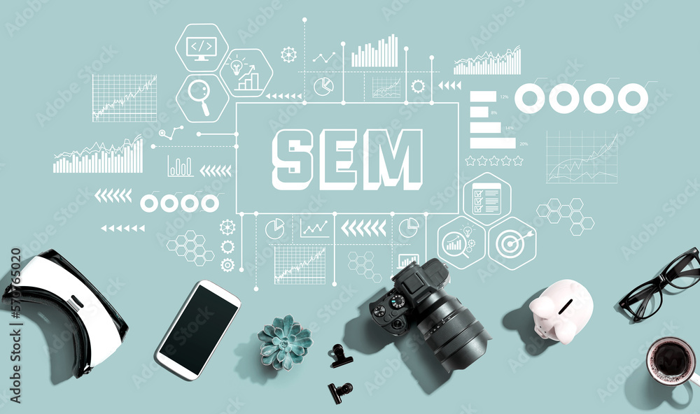 SEM - Search Engine Marketing theme with electronic gadgets and office supplies - flat lay