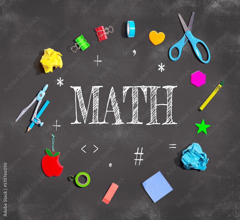 Math theme with school supplies on a chalkboard - flat lay