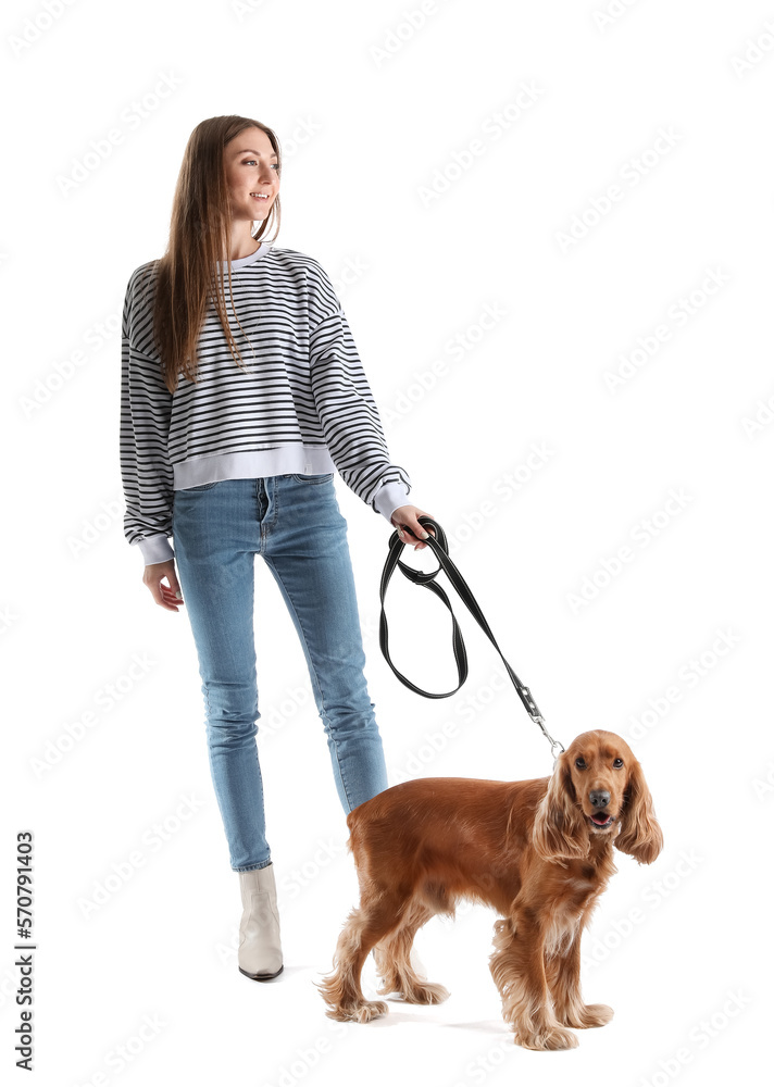 Young woman with red cocker spaniel on white background