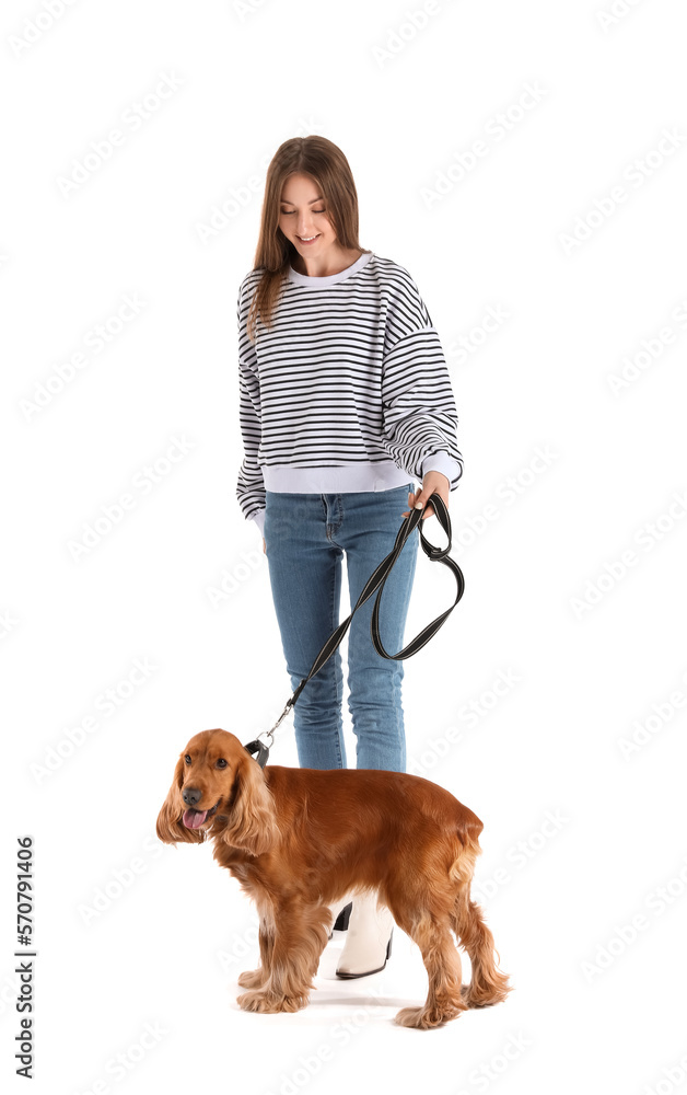 Young woman with red cocker spaniel on white background