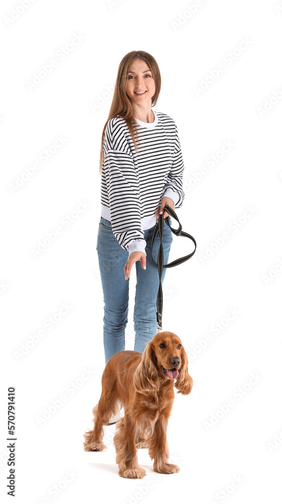 Young woman with red cocker spaniel on white background