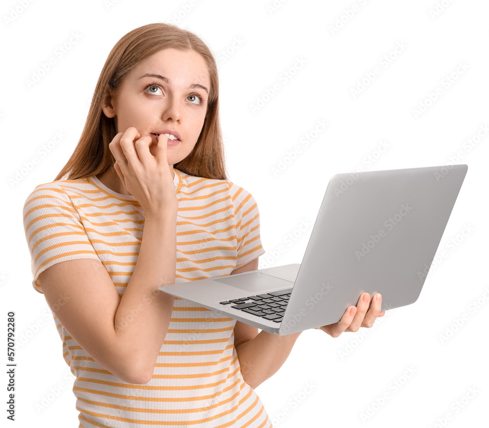 Young woman with laptop biting nails on white background