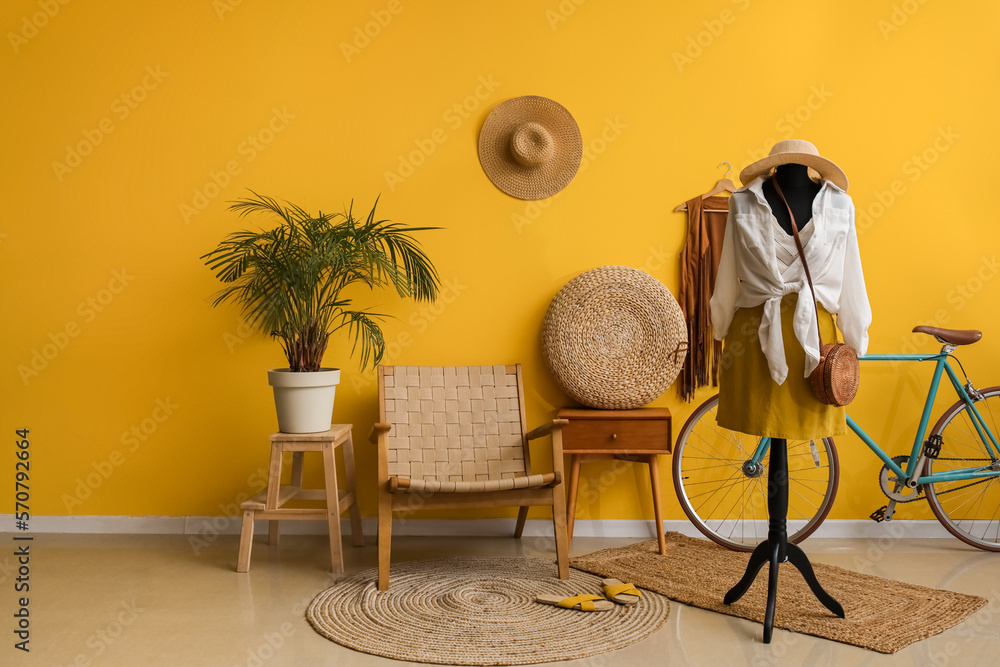 Interior of fashion designers studio with mannequin, clothes and bicycle