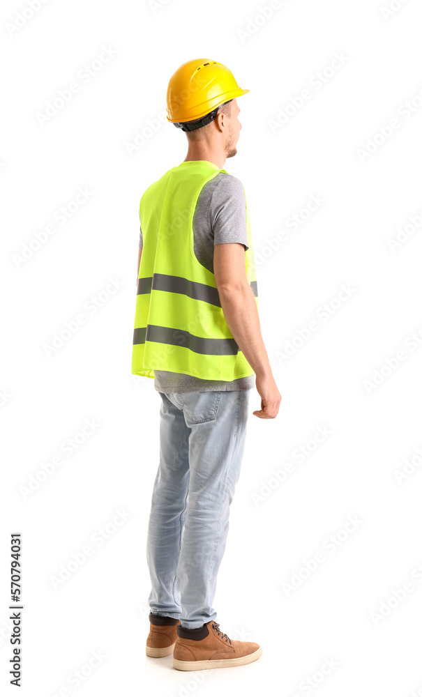 Male worker in vest and hardhat on white background