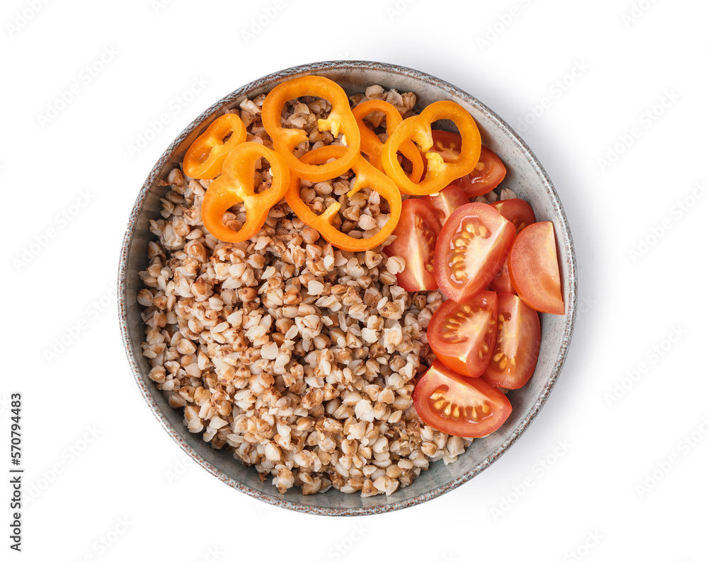 Bowl of tasty buckwheat porridge with fresh vegetables isolated on white background