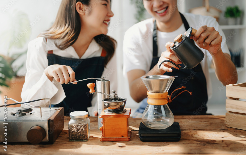 Cute couple, male and female barista working in coffee shop Barista working at cafe Alternative ways