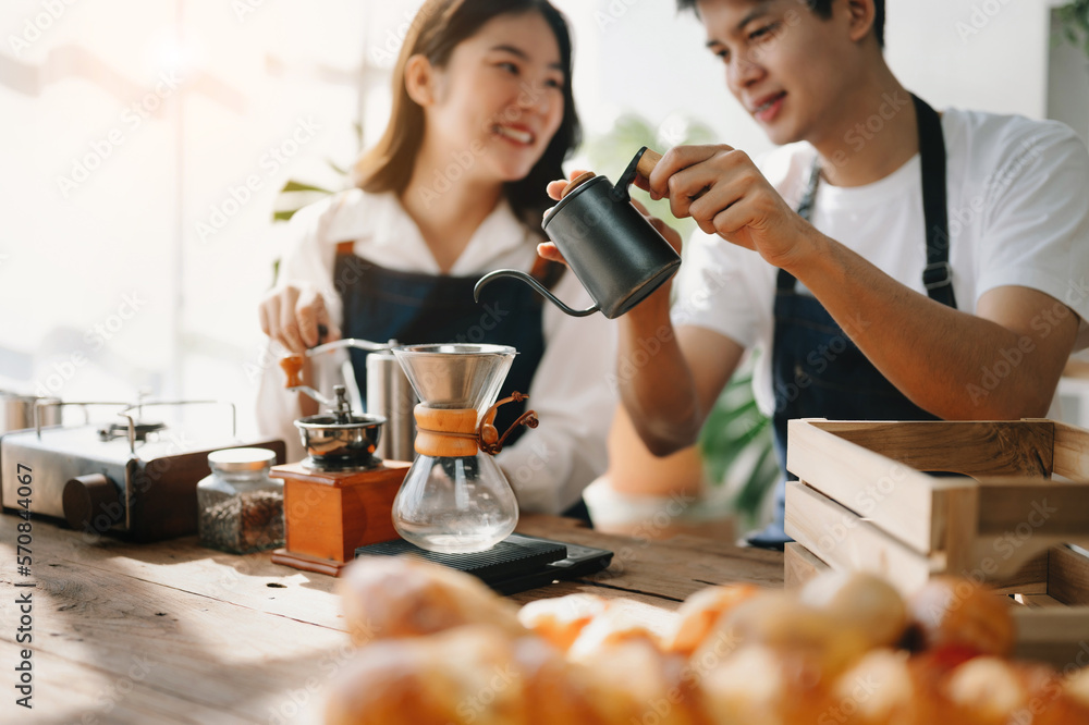 Cute couple, male and female barista working in coffee shop Barista working at cafe Alternative ways