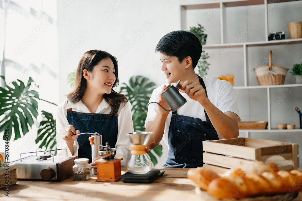 Cute couple, male and female barista working in coffee shop Barista working at cafe Alternative ways