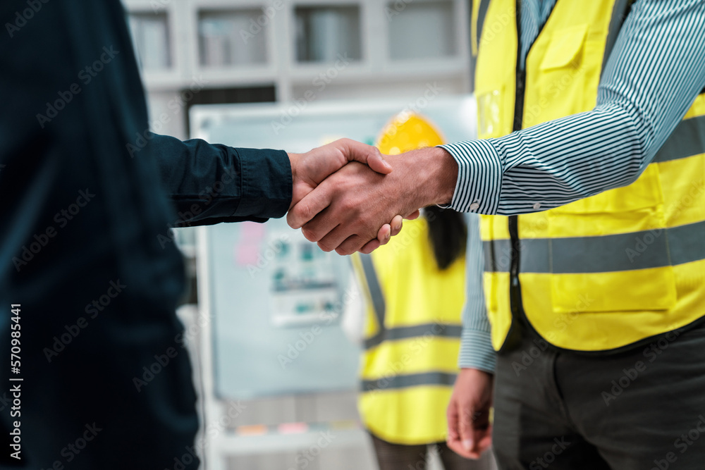 After concluding the meeting, competent investor shakes hands with engineer. Concept of the agreemen