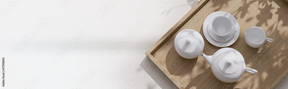 Top view of modern, minimal, beautiful white ceramic teapot, teacup with saucer on brown straw mat w