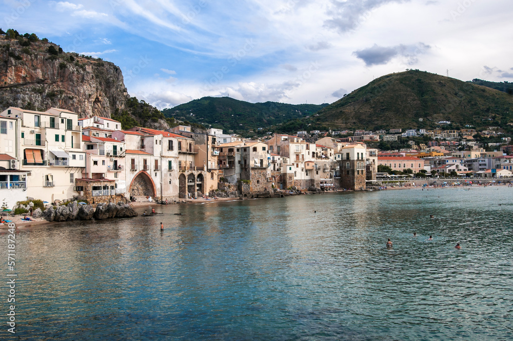 The fishing village of Cefalu in Sicily / The fishing village of Cefalu with its town beach on Sicil