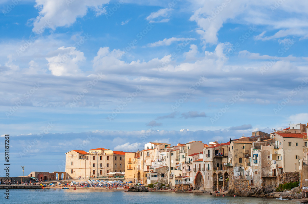 The fishing village of Cefalu in Sicily / The fishing village of Cefalu with its town beach on Sicil