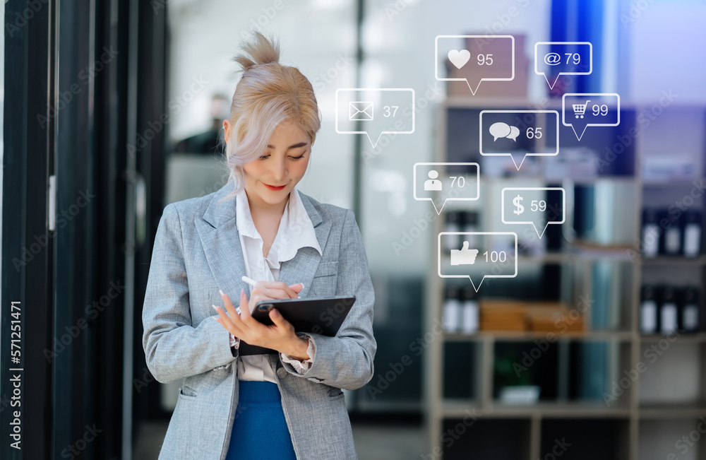 Asian woman typing smartphone, keyboard  with laptop computer of.Social media and Marketing virtual 