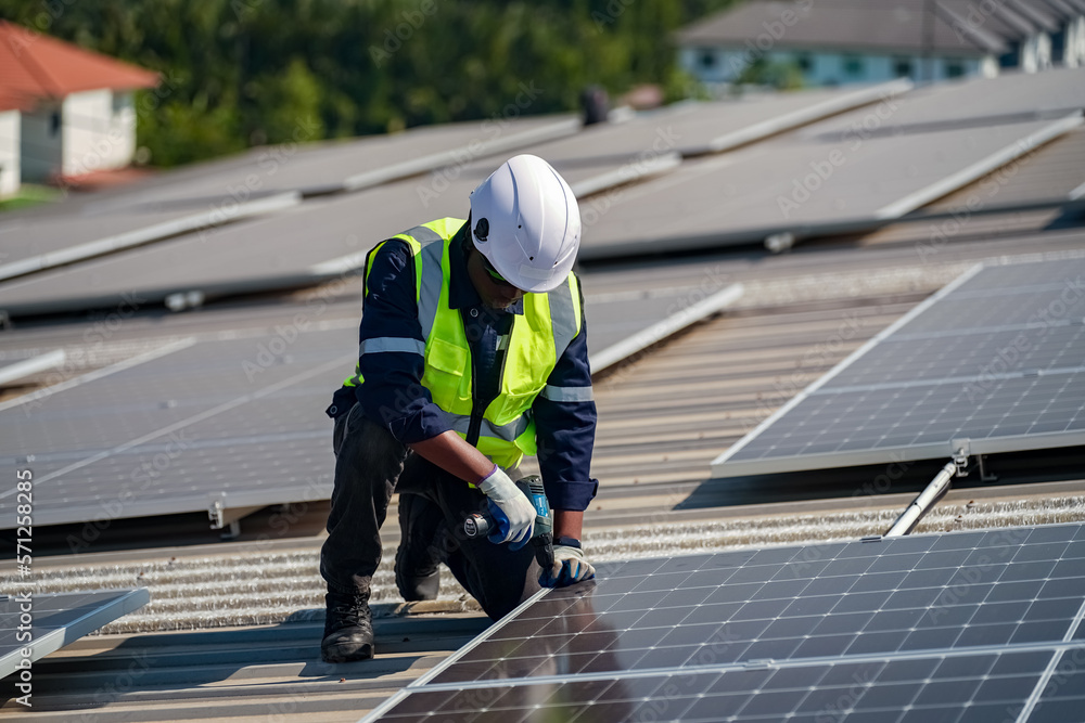 Technology solar cell, Engineer service check installation solar cell on the roof of factory. techni