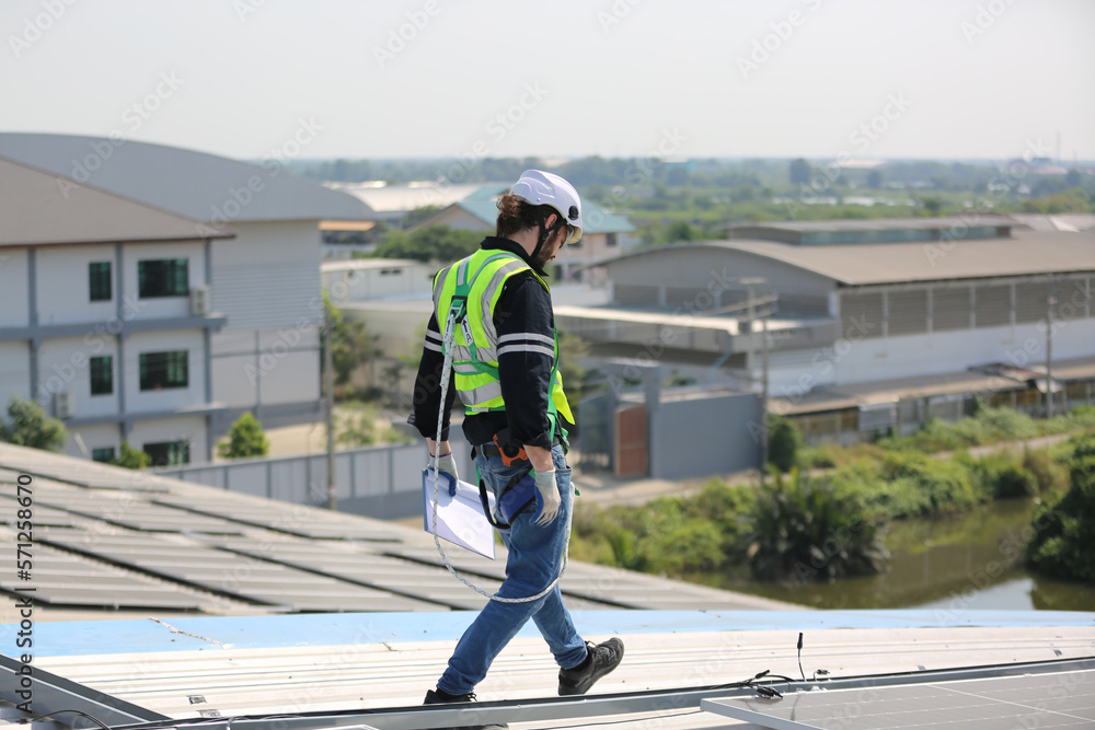 Technology solar cell, Engineer service check installation solar cell on the roof of factory. techni