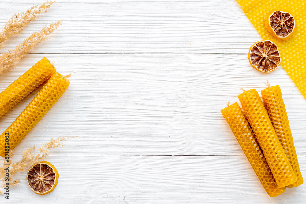 Process of making honey aroma beeswax candles with honeycombs, top view