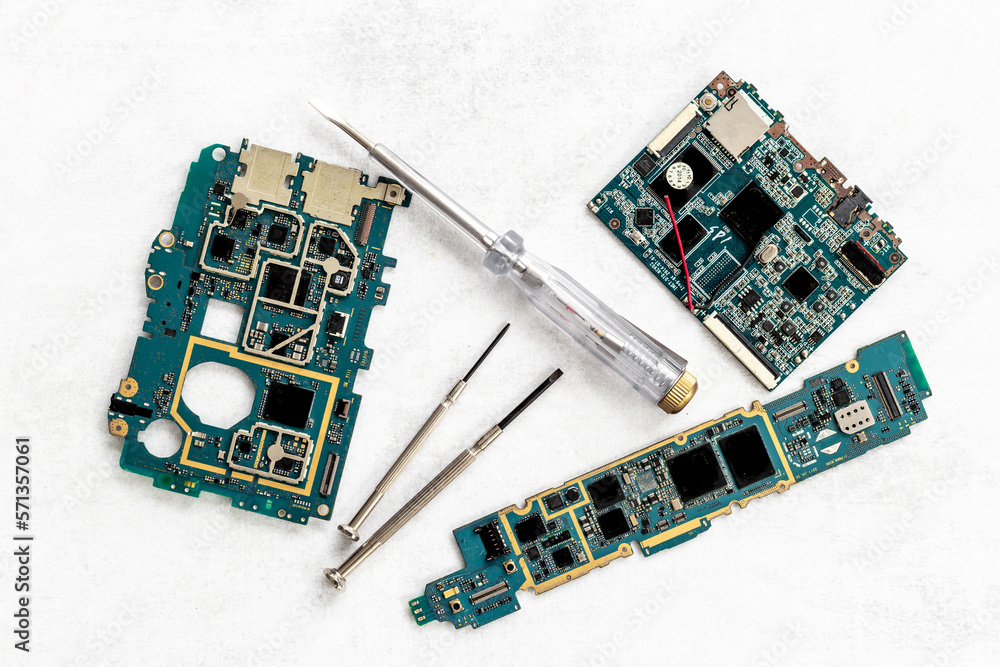 Tech support or repair servise concept. Circuit board with equipment and tools