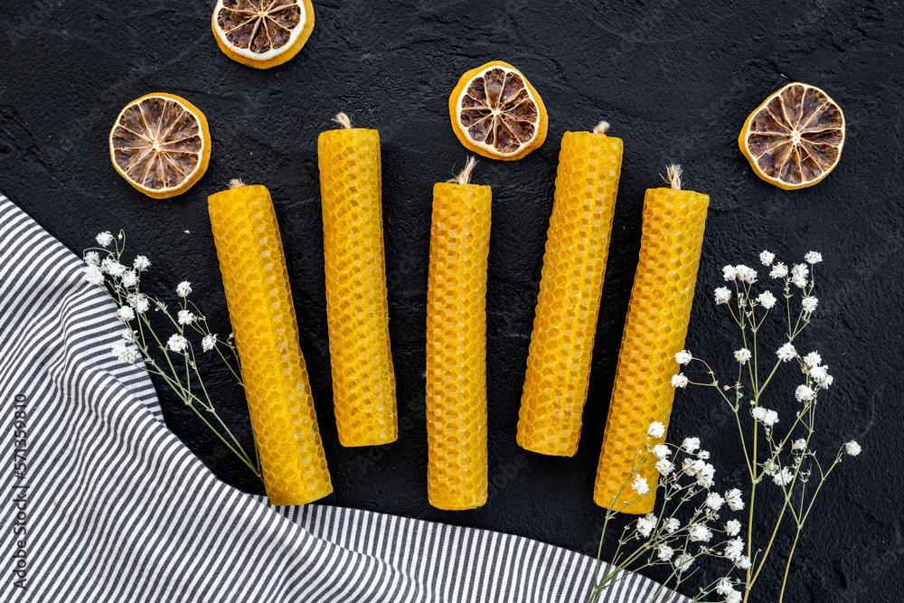 Process of making honey aroma beeswax candles with honeycombs, top view