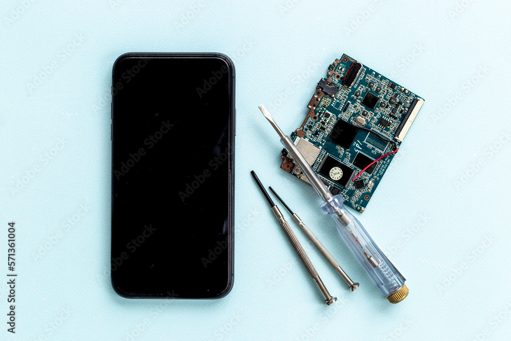 Repairing electronics circuit board - mobile phone with microchips