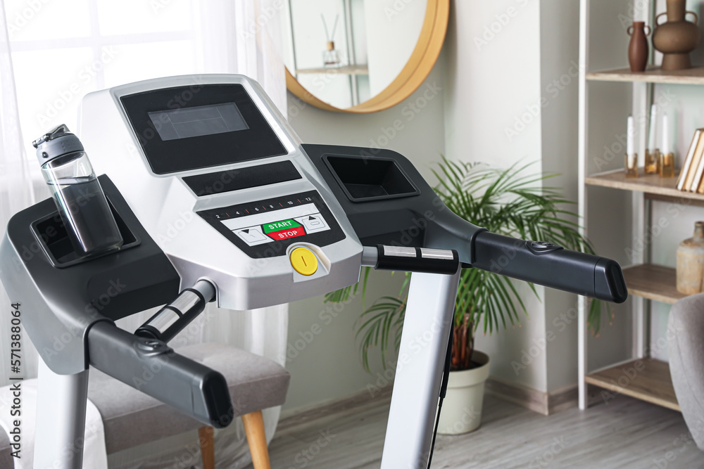 Modern treadmill in light room, closeup