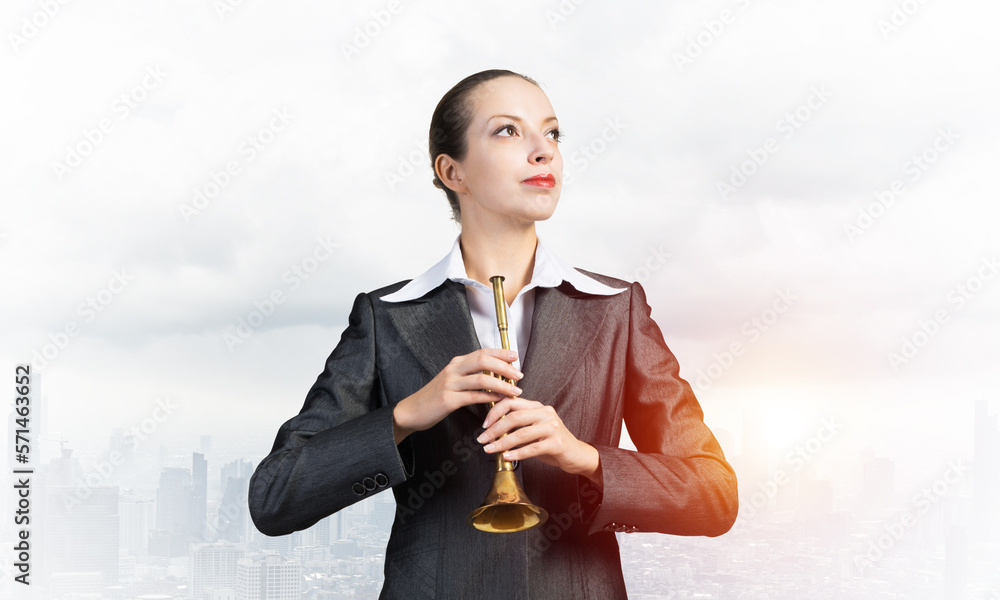 Business woman playing the trumpet