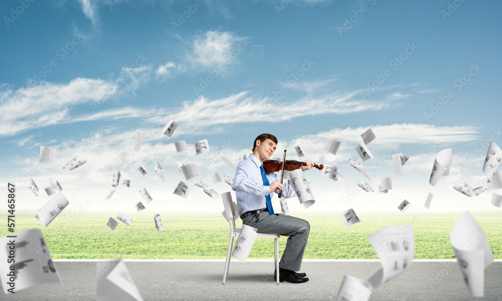 young businessman playing violin