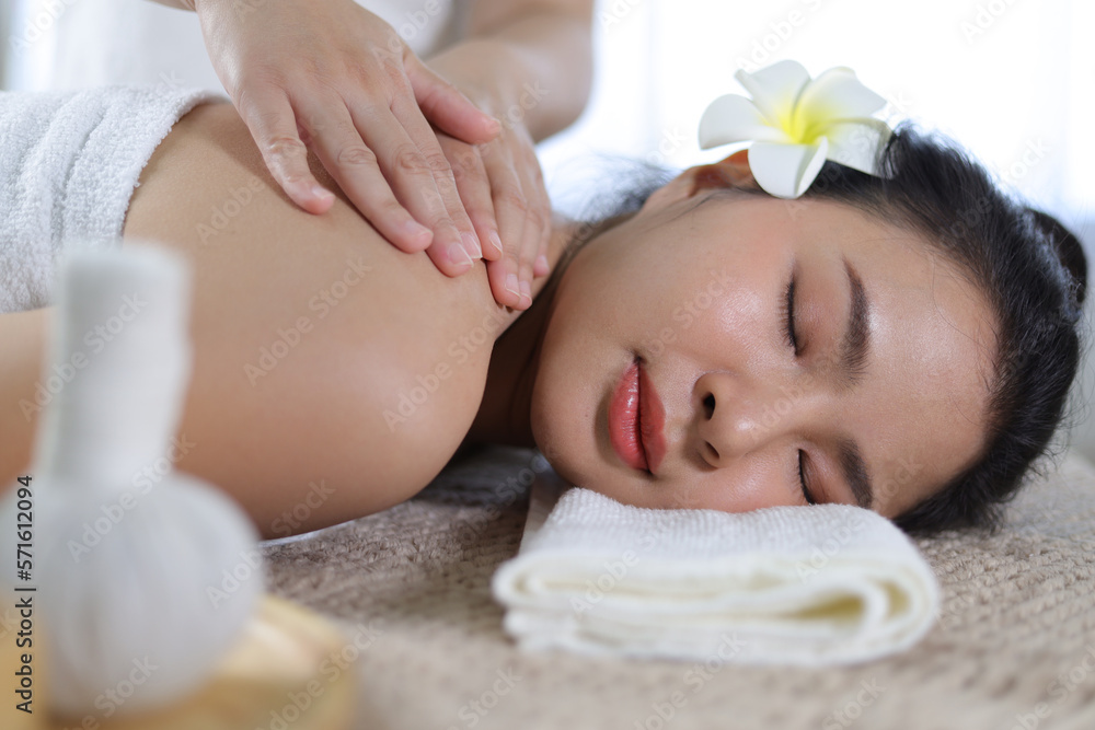 Masseur doing massage on woman body in the spa salon. Body care and beauty treatment concept.