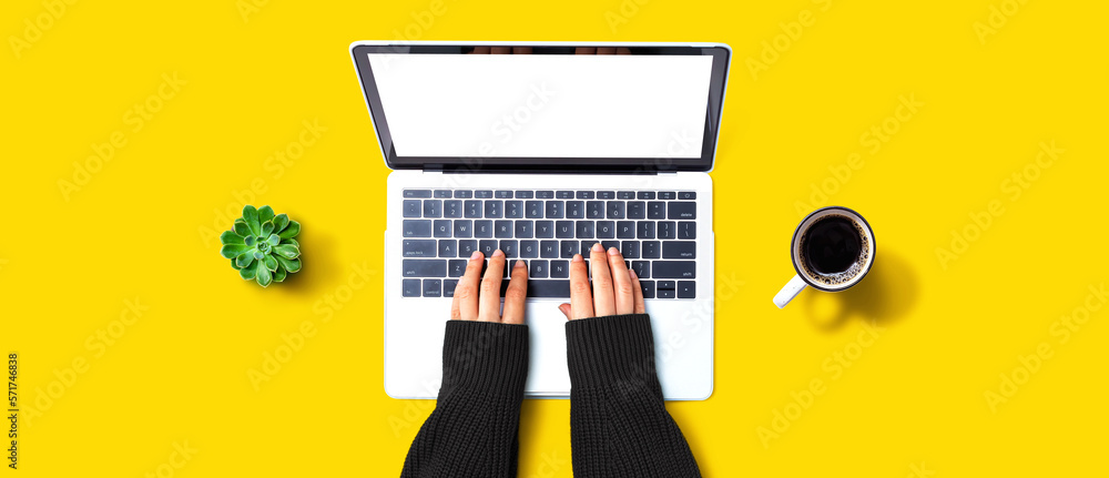 Person using a laptop computer from above