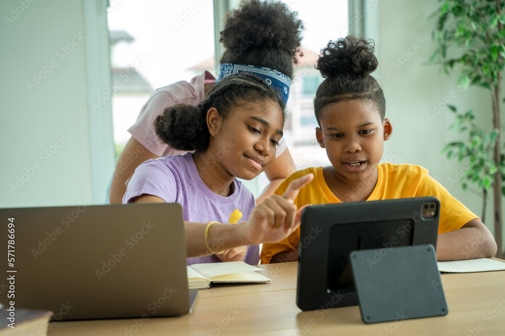 Black girl are taking test in elementary classroom school with diverse group of bright children work