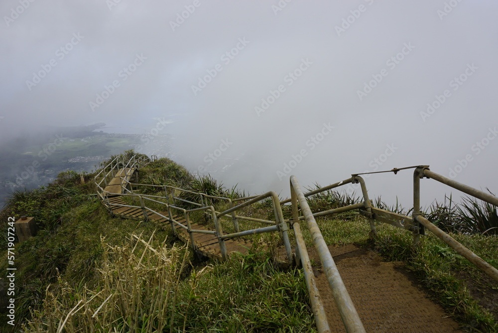 Haiku Stairs to heaven in clouds.  Known as Stairs to Heaven or Haiku Ladder. Steel step Structure  