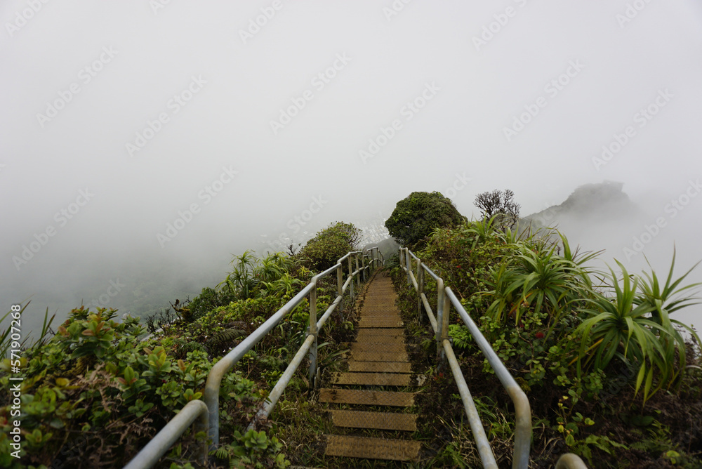 Haiku Stairs to heaven in clouds.  Known as Stairs to Heaven or Haiku Ladder. Steel step Structure  