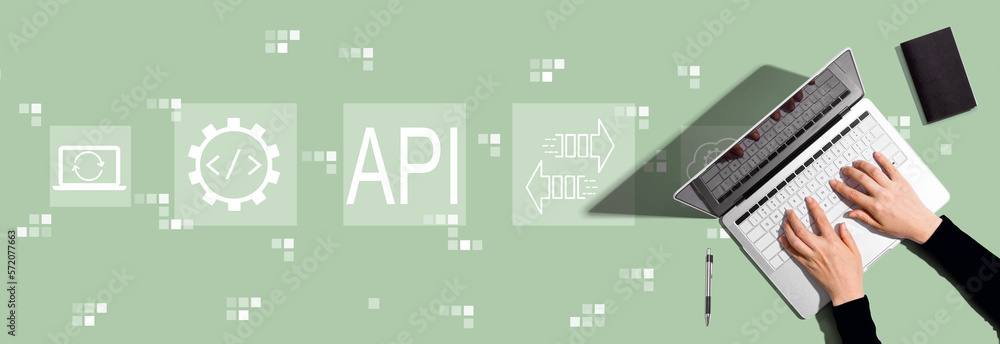 API - application programming interface concept with person using a laptop computer