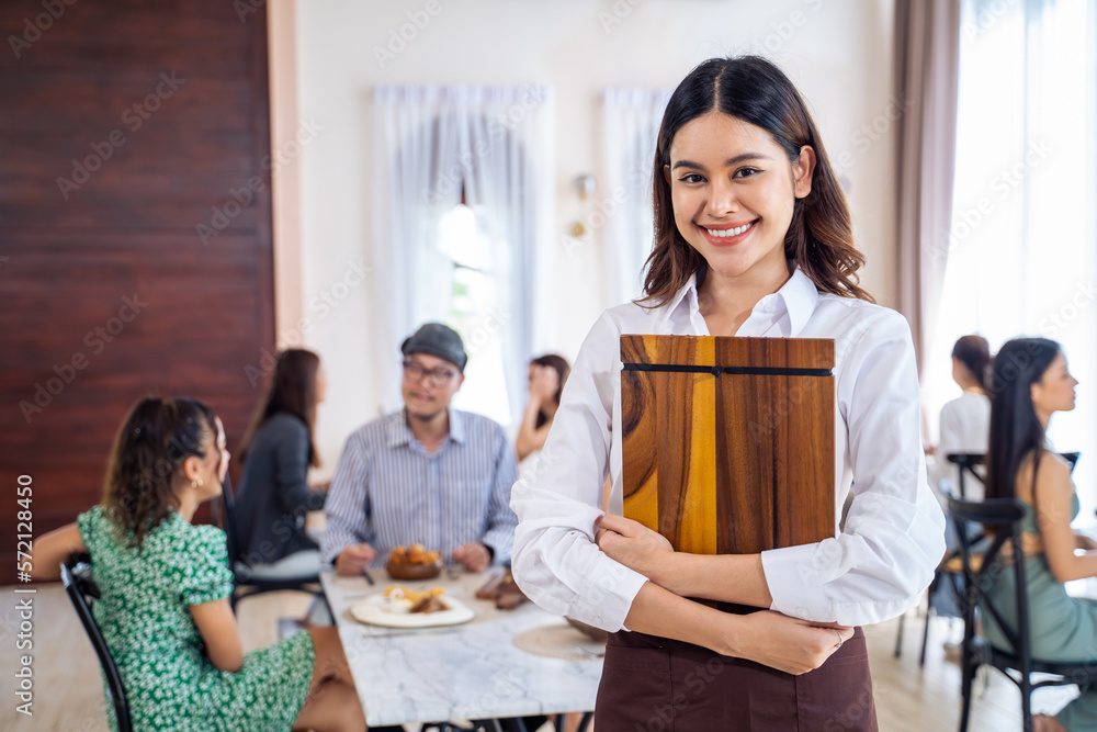 Portrait of Caucasian waiter standing and look at camera in restaurant