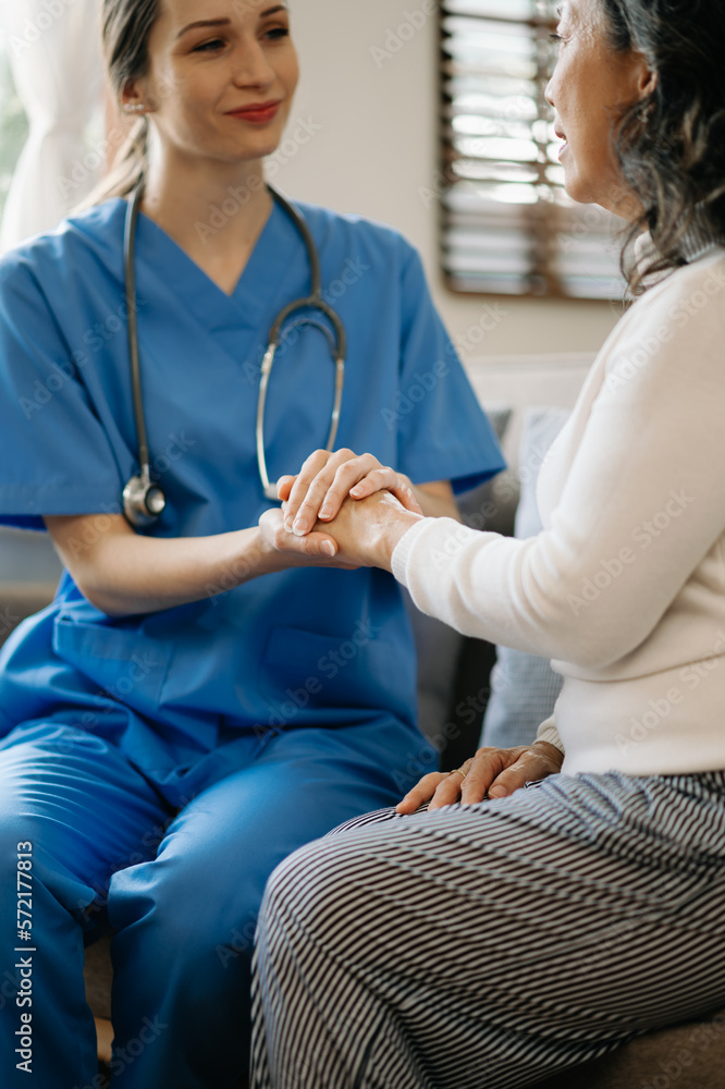 Asian female hands touching old female hand Helping hands take care of the elderly concept in  hospi