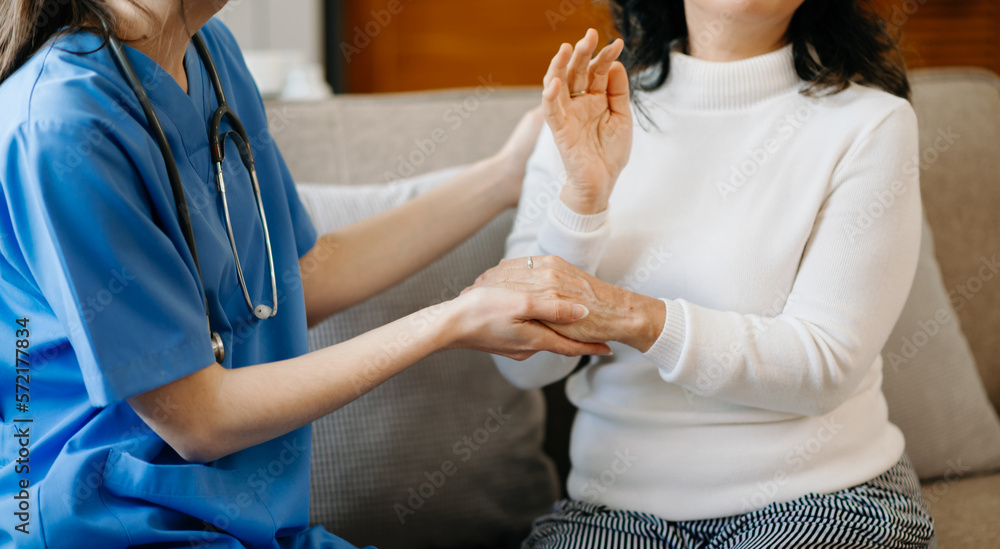 Asian female hands touching old female hand Helping hands take care of the elderly concept in  hospi