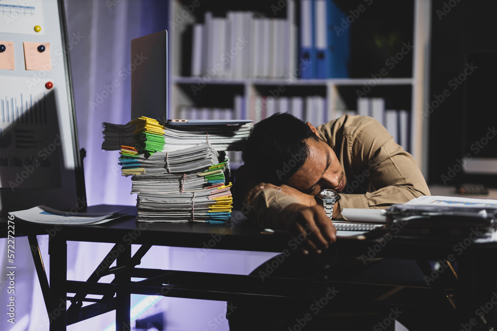 Business people in the night office who work overtime are sleepy and tired from overwork.