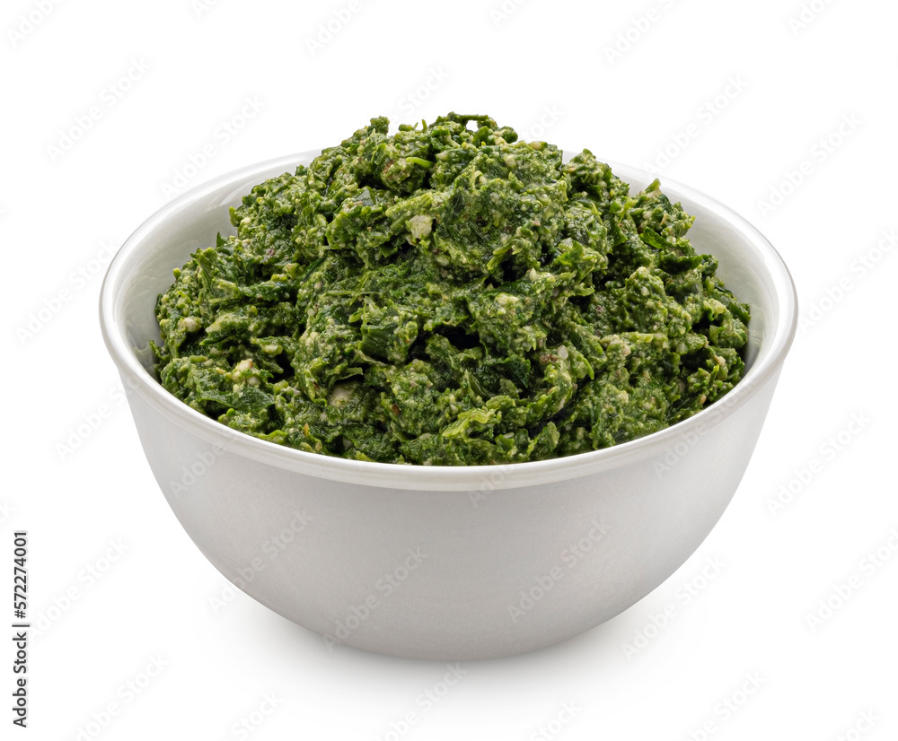 Pesto sauce in bowl isolated on white background