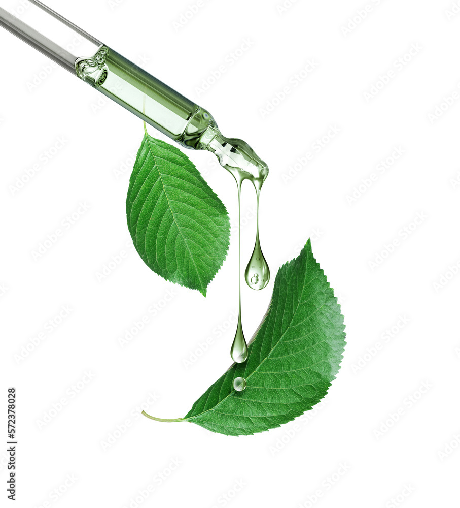 Cosmetic pipette with green leaves close-up on a white background