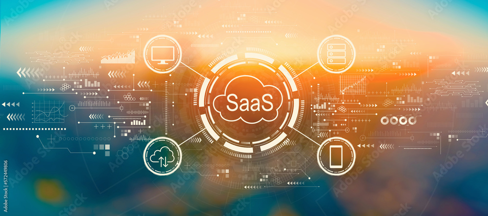 SaaS - software as a service concept with blurred cityscape at sunset or sunrise