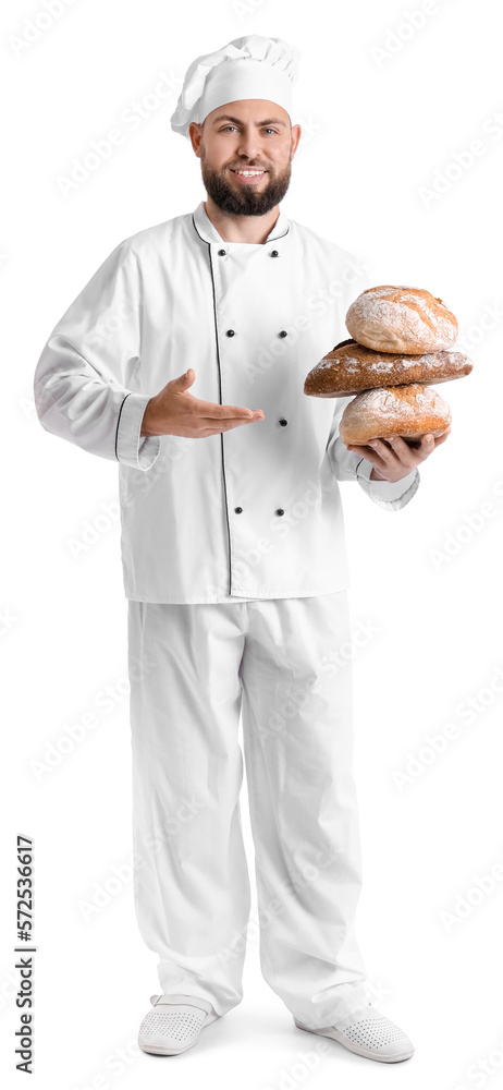 Male baker with loaves of fresh bread on white background