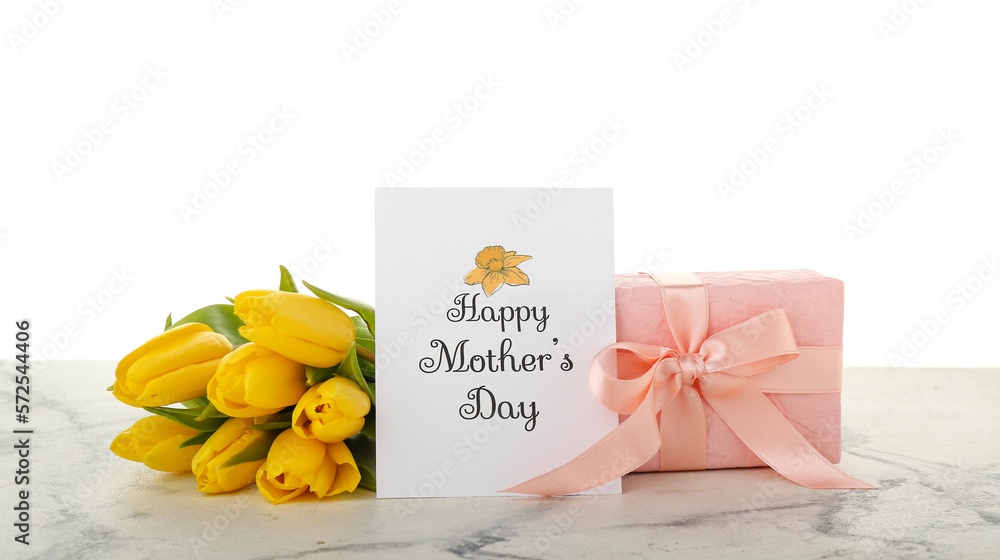 Greeting card with text HAPPY MOTHERS DAY, tulips and gift on table against white background