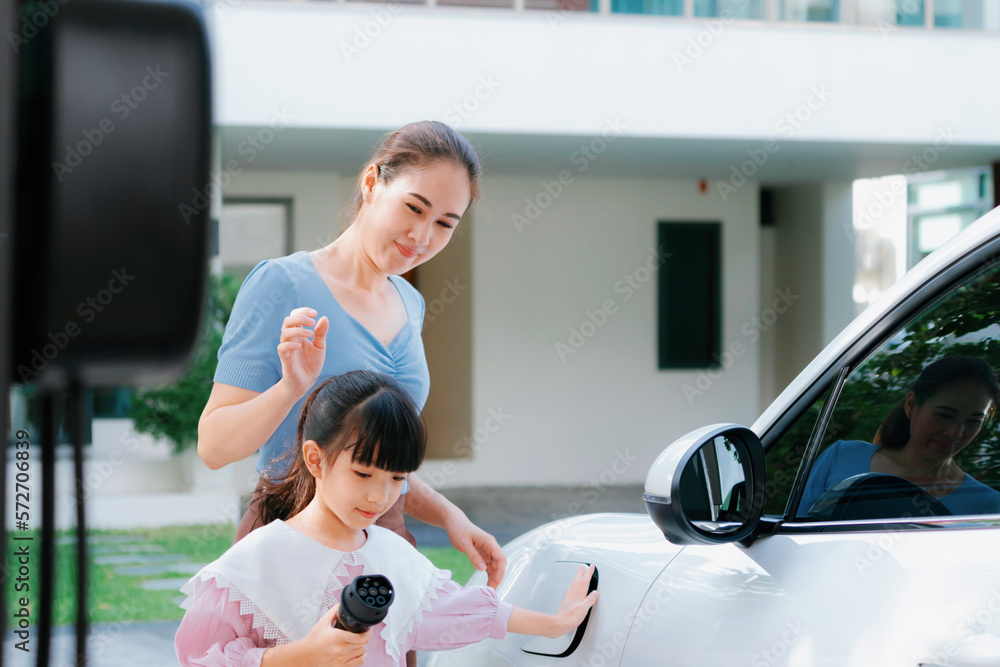 Progressive lifestyle of mother and daughter who have just returned from school in an electric vehic