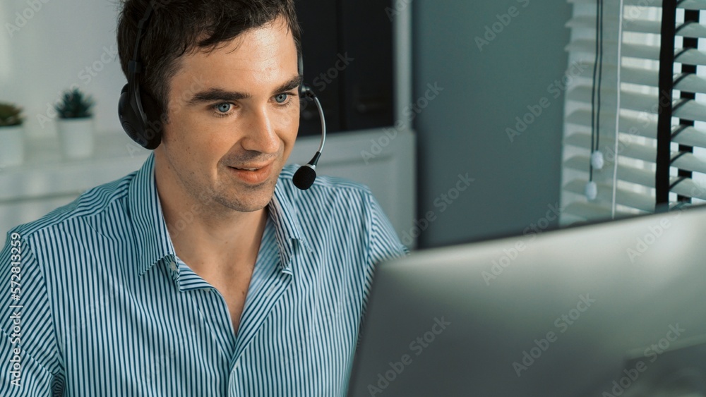 Competent male operator working with customers in the office. Concept of an operator, customer servi