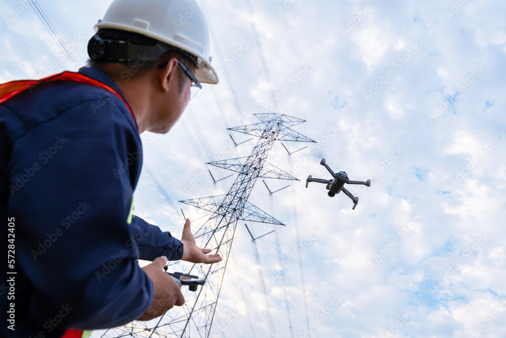 An engineers or technician are launching drones to inspect the power station for a planned work by g