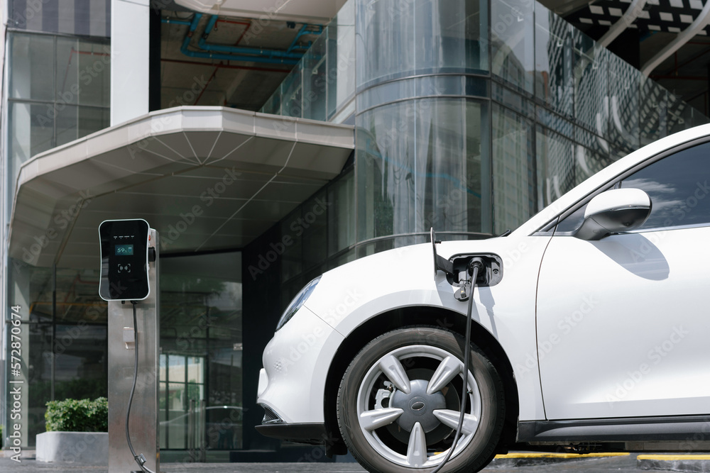 Progressive electric vehicle recharging battery at charging station powered by sustainable clean ene