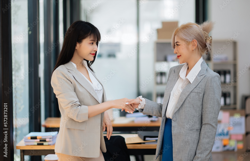 Business partnership handshake concept.Photo two coworkers handshaking process.Successful deal after