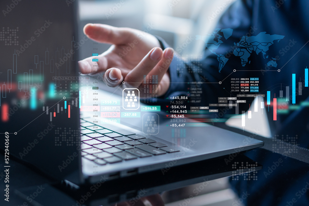 Businessman using computer analyzing business graph chart data and investment to planning and strate