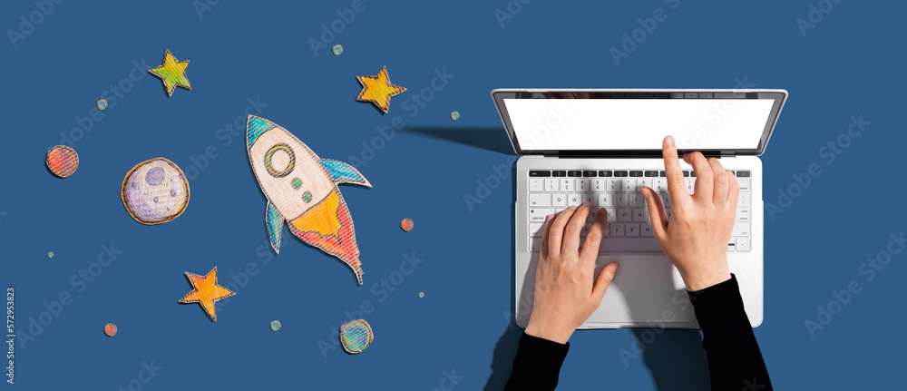 Space exploration theme with a rocket and a laptop